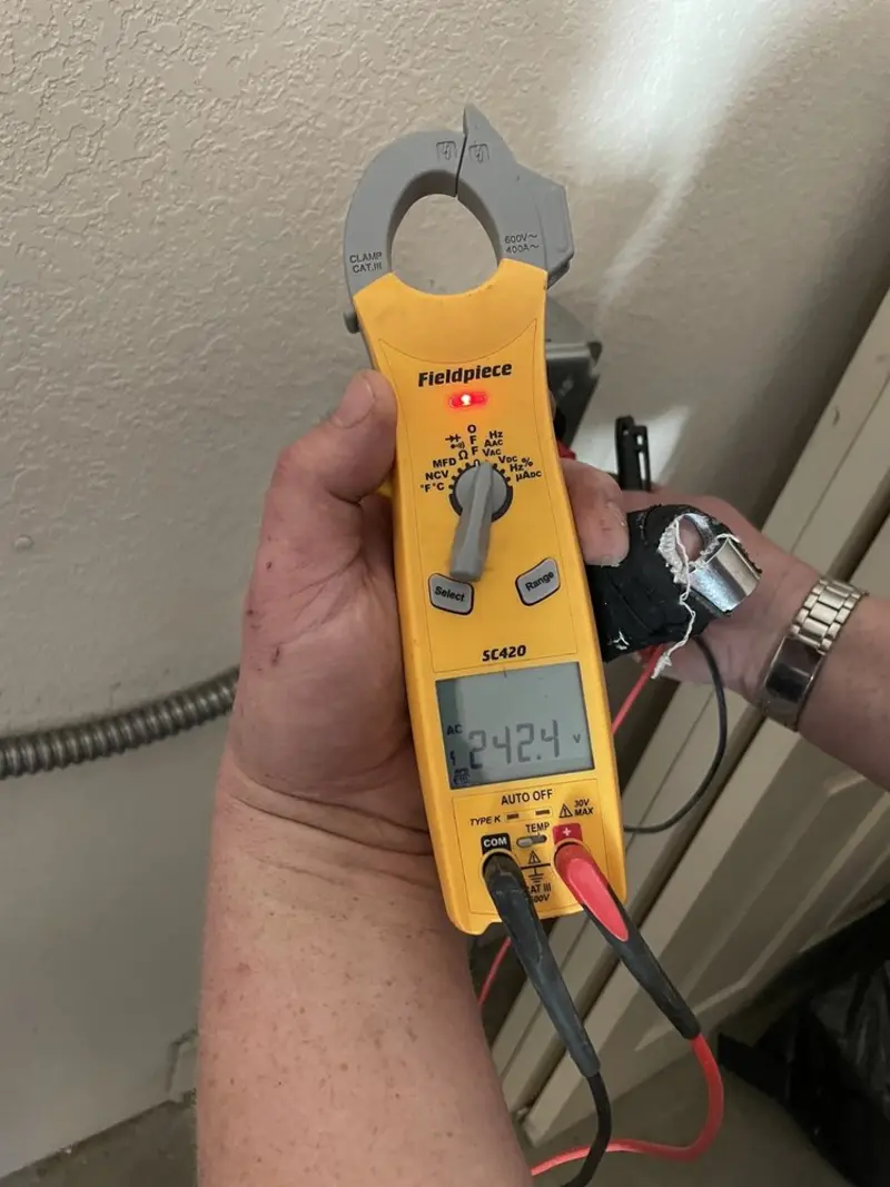 Voltage testing with clamp meter during Generator Installation in Rancho Mission Viejo